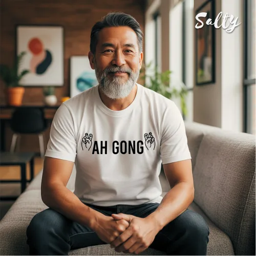 Ah Gong short sleeve T-shirt Singapore streetwear — white unisex cotton tee with bold black AH GONG print and tribal‑inspired graphic design, Wet Tee Shirt x Salty collaboration.