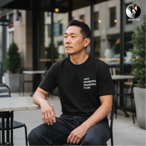 Unisex black short sleeve T-shirt with bold white “ANTI MAHJONG MAHJONG CLUB” slogan, witty Singapore streetwear by Wet Tee Shirt®