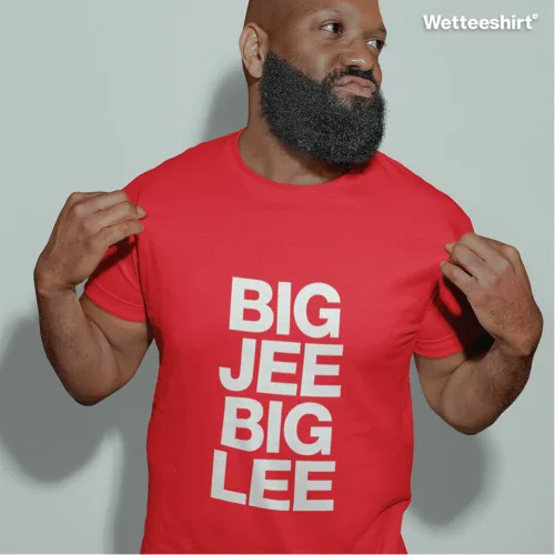 Person holding sides of bright red Wetteeshirt® tee with bold white stacked text ‘BIG JEE BIG LEE’, eye‑catching unisex streetwear design inspired by playful Singapore slang.jpg