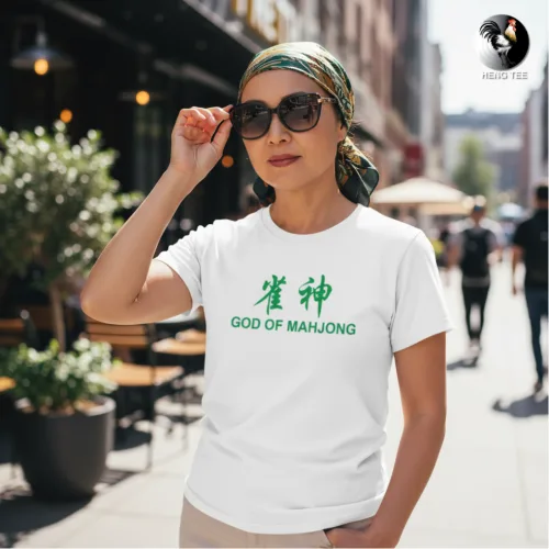 Unisex white short sleeve T-shirt with green Chinese characters “雀神” and bold “GOD OF MAHJONG” text, witty Singapore streetwear by Wet Tee Shirt®