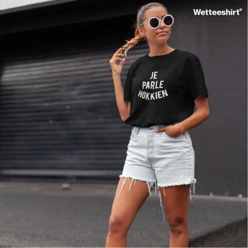 Unisex black short sleeve T-shirt with bold white “Je Parle Hokkien” slogan, witty Singapore streetwear by Wet Tee Shirt®