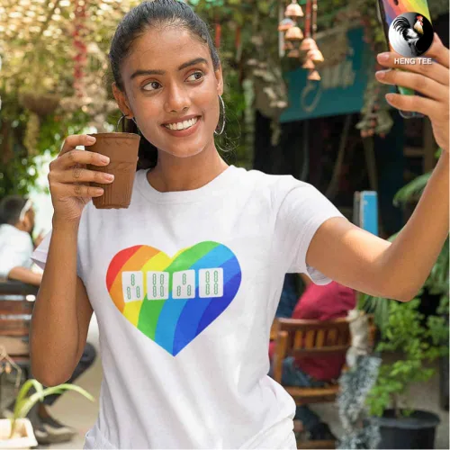 Unisex white short sleeve T-shirt with large rainbow heart graphic featuring four colorful domino tiles, pride-inspired Singapore streetwear by Wet Tee Shirt®