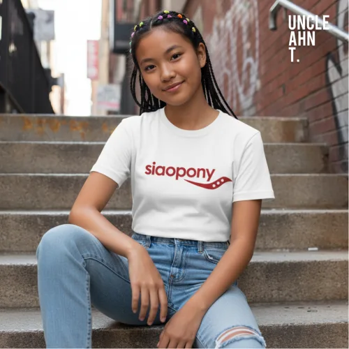 Singapore streetwear siaopony white short sleeve T-shirt, bold red text with wavy underline graphic, casual unisex tee by Uncle Ahn T, premium cotton playful design photographed outdoors in urban alley with concrete steps