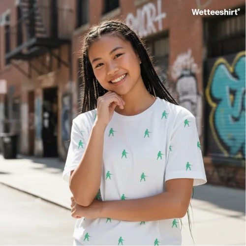 White streetwear T-shirt with repeating green figure pattern, playful Wet Tee Shirt® urban design