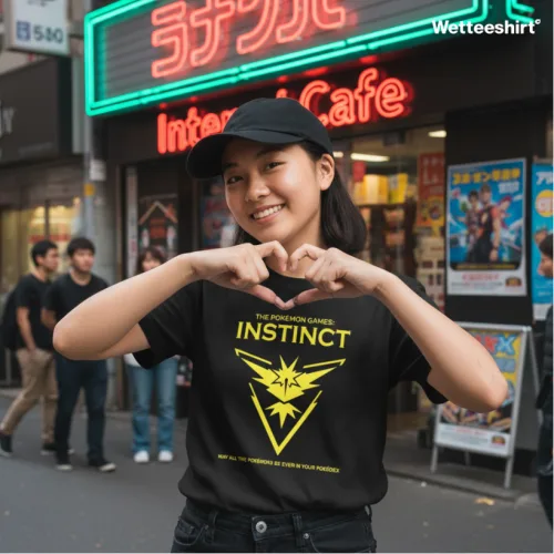 Black streetwear T-shirt with yellow Pokémon GO Team Instinct logo and slogan, Wet Tee Shirt® pop culture design