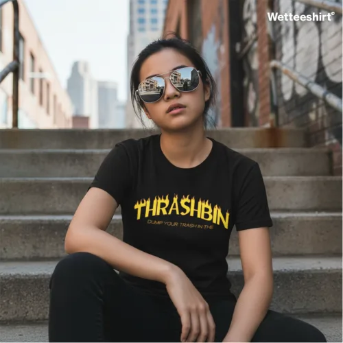 Black streetwear T-shirt with yellow Thrashbin text and Dump Your Trash in Me slogan, Wet Tee Shirt® ironic urban design