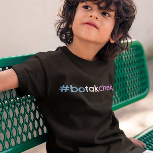 boy-wearing-a-tee-mockup-sitting-on-a-green-bench.jpg