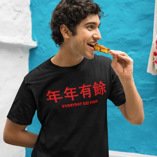 gildan-t-shirt-mockup-of-a-man-eating-a-street-food-snack.jpg