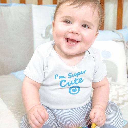 mockup-of-a-smiling-baby-boy-sitting-in-his-crib-while-wearing-a-onesie.jpg