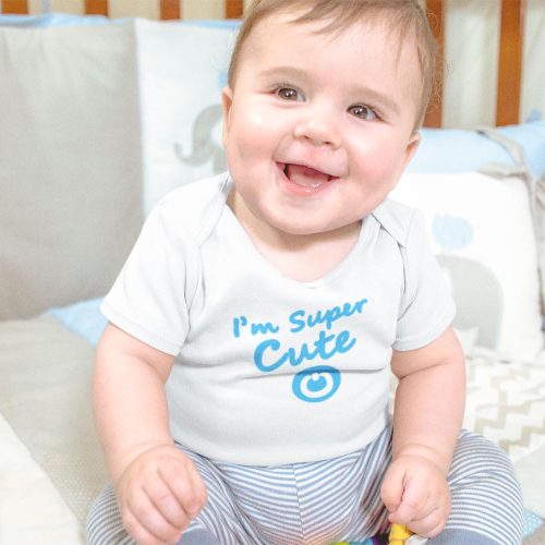 mockup-of-a-smiling-baby-boy-sitting-in-his-crib-while-wearing-a-onesie.jpg