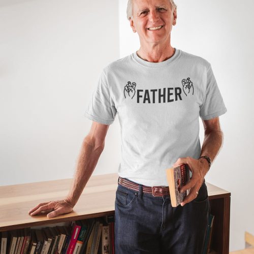smiling-man-wearing-a-tshirt-mockup-holding-a-book-in-his-house.jpg