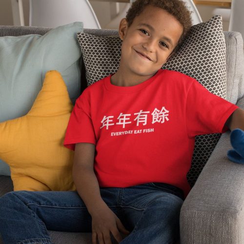 t-shirt-mockup-featuring-a-smiling-kid-sitting-on-a-couch.jpg