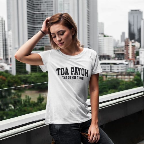 toa-payoh-t-shirt-mockup-featuring-a-short-haired-woman-posing-on-a-balcony
